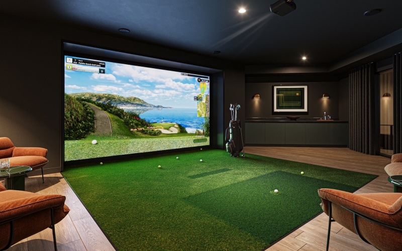 a room with a large screen and chairs