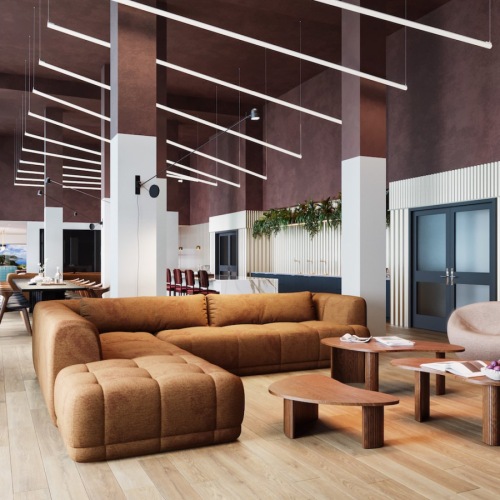 a room with a couch and chairs