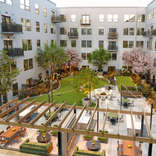 a courtyard with trees and buildings