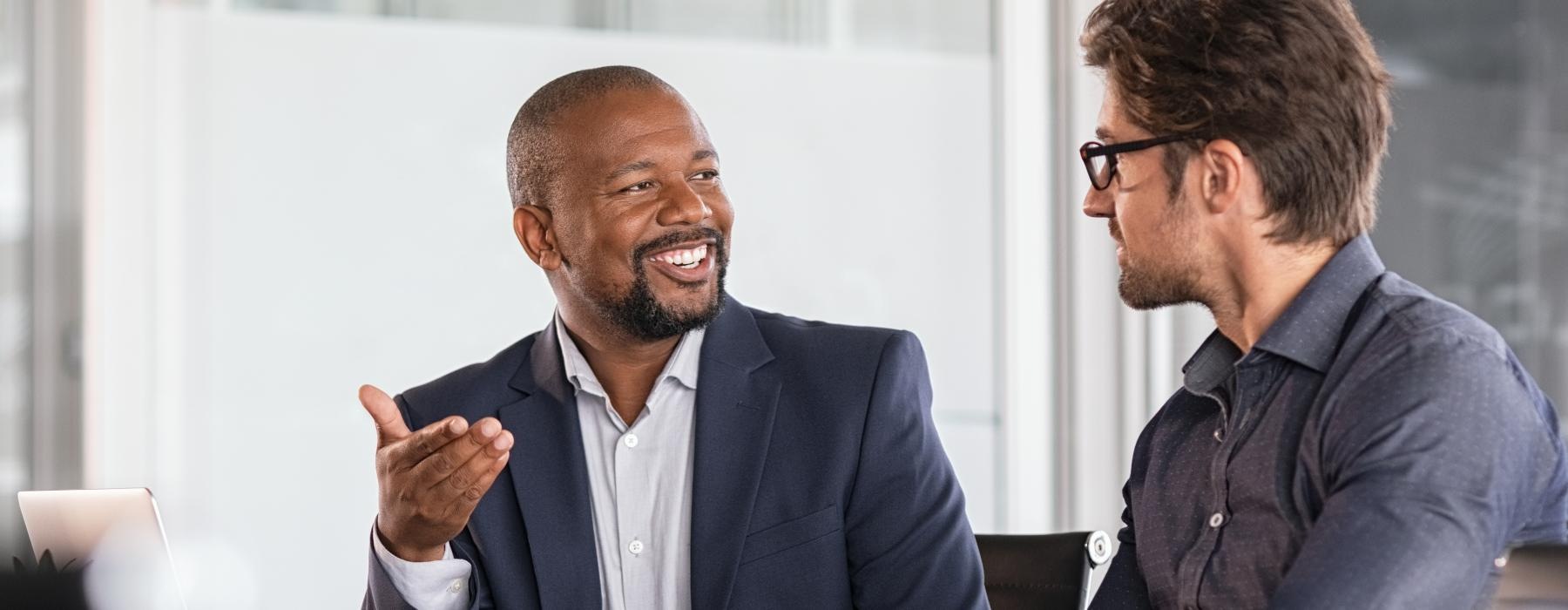 a few men talking and laughing
