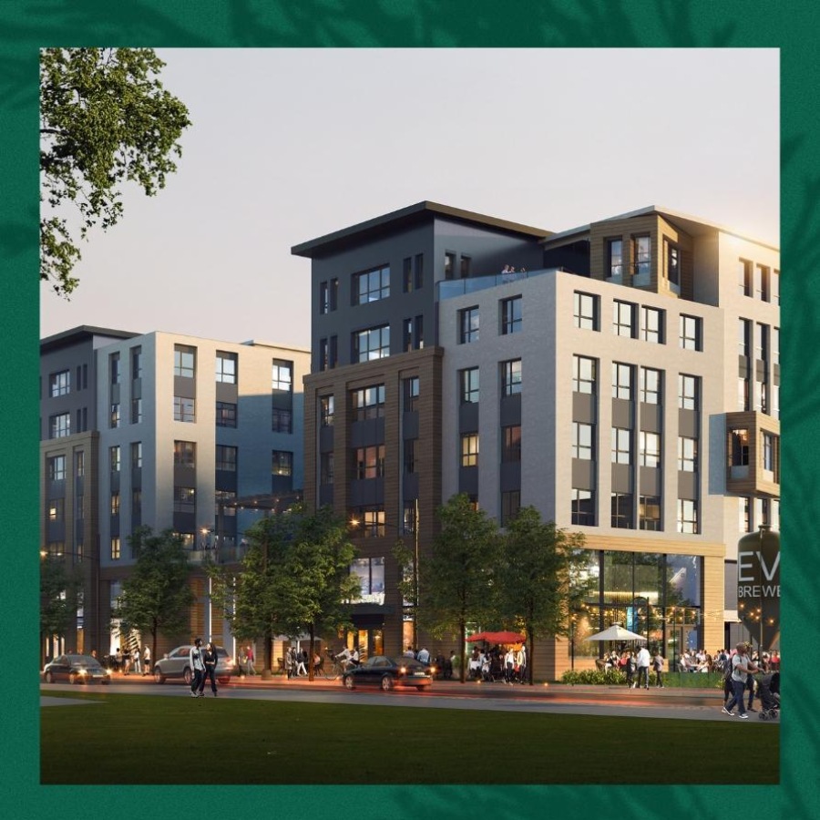 a large building with many windows in front of a street